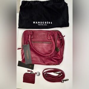 Wanderers Travel Co Women's Leather Bag
NWT. Burgundy/Dk pink